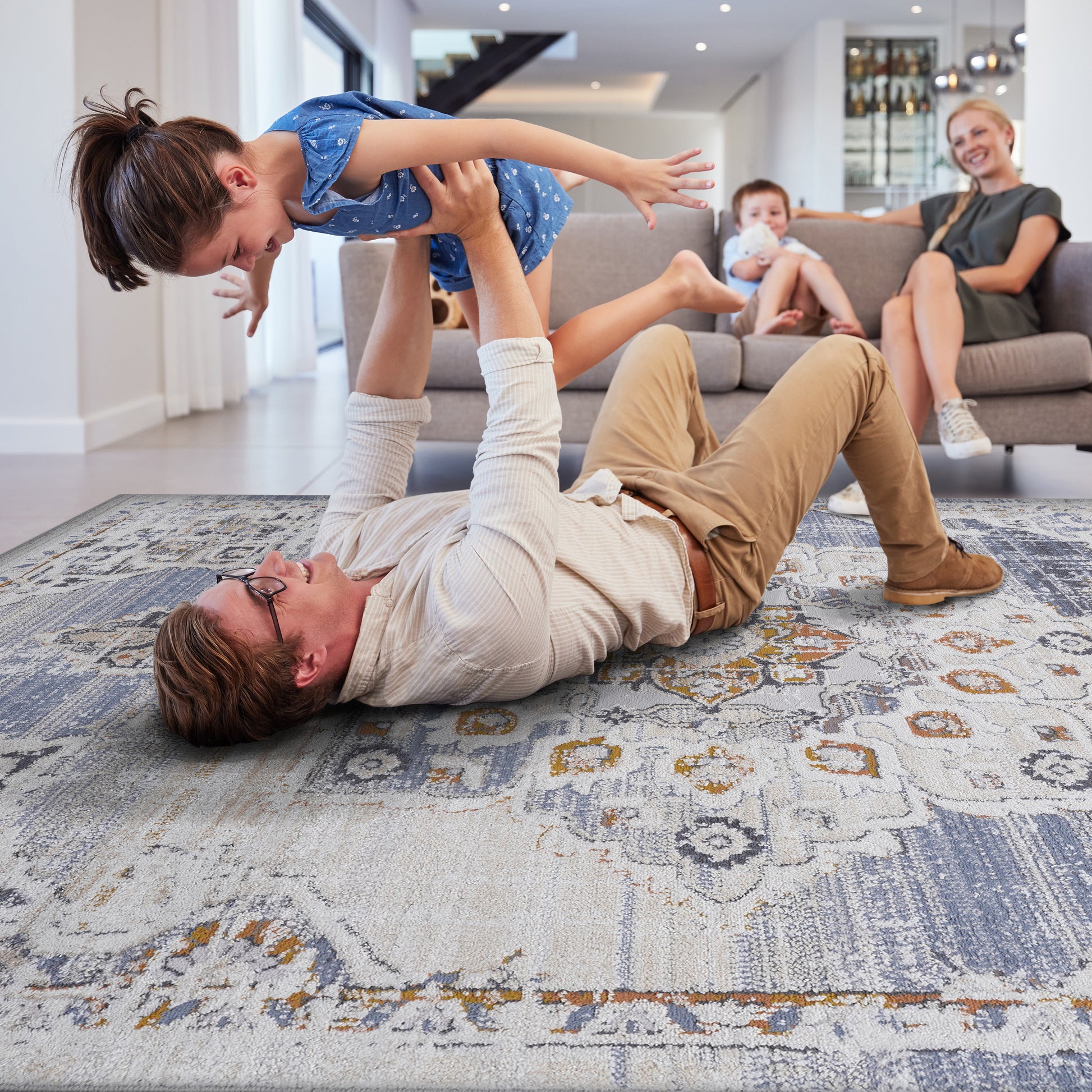 Distressed Persian rug with blue cream and gold intricate patterns adding warmth to living spaces