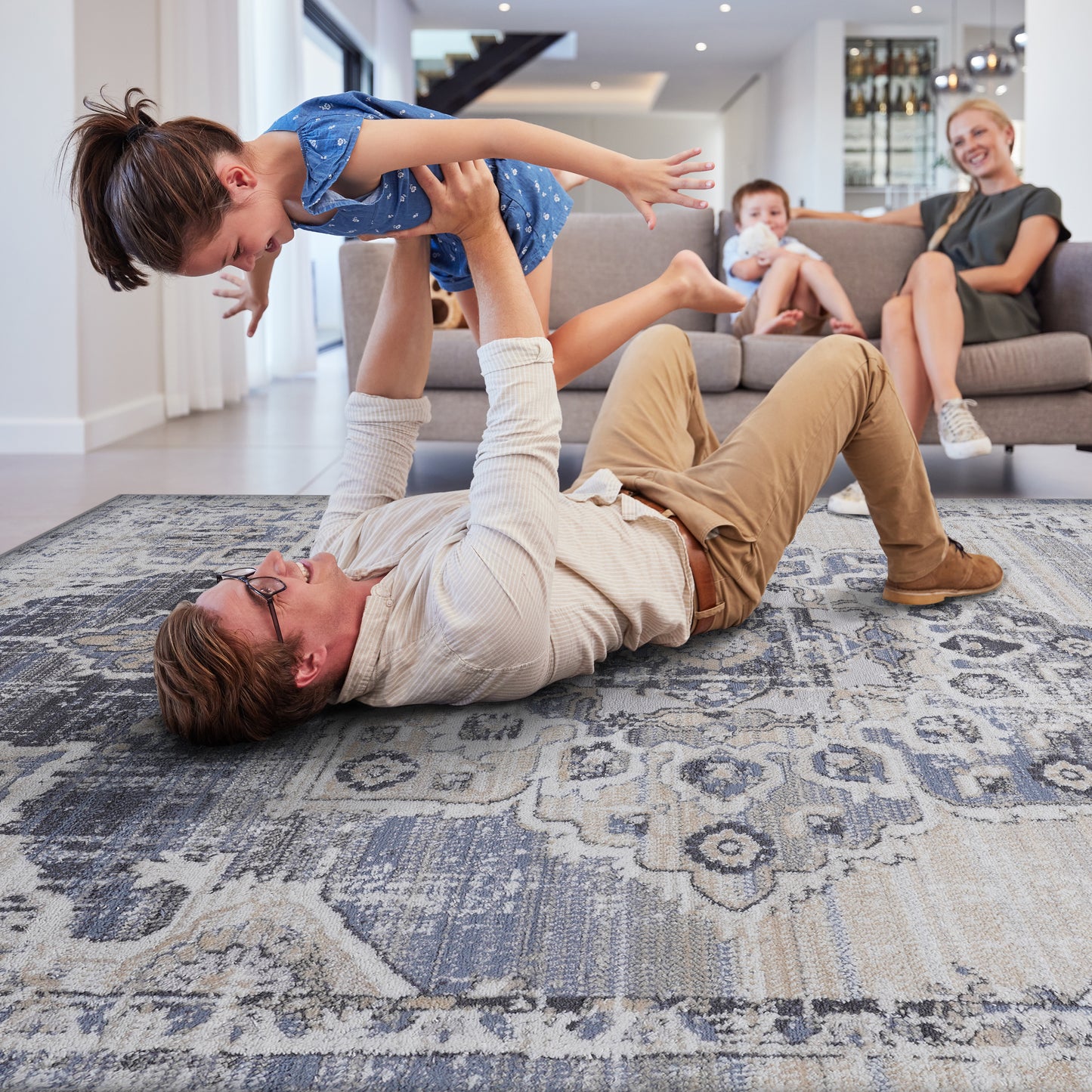 Abstractpatterned area rug in muted blues grays and cream x ft