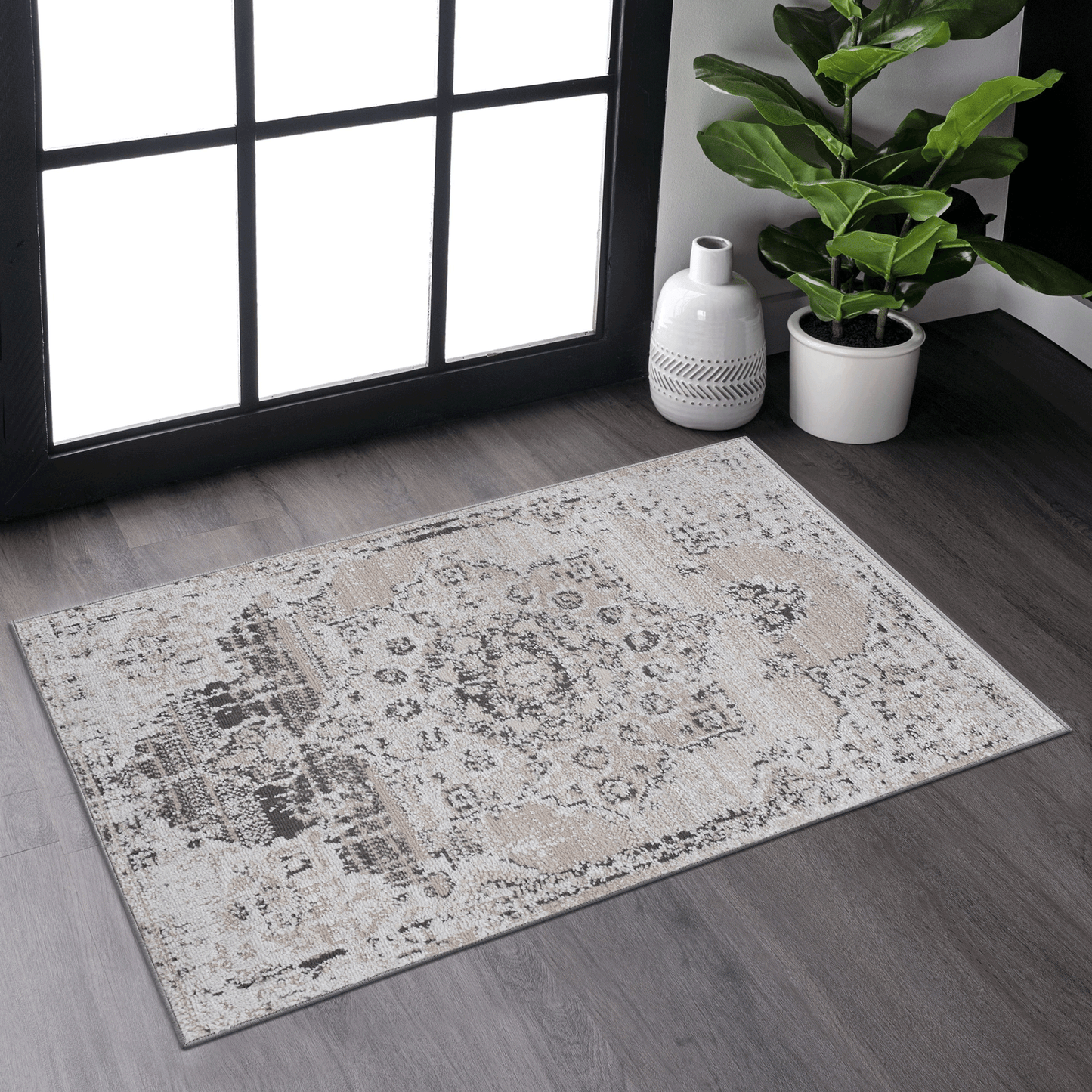 Distressed medallion grey and beige area rug with subtle pattern details