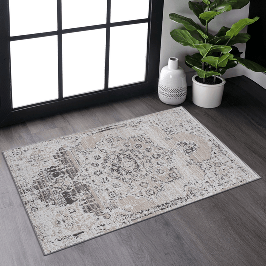 Distressed medallion grey and beige area rug with subtle pattern details
