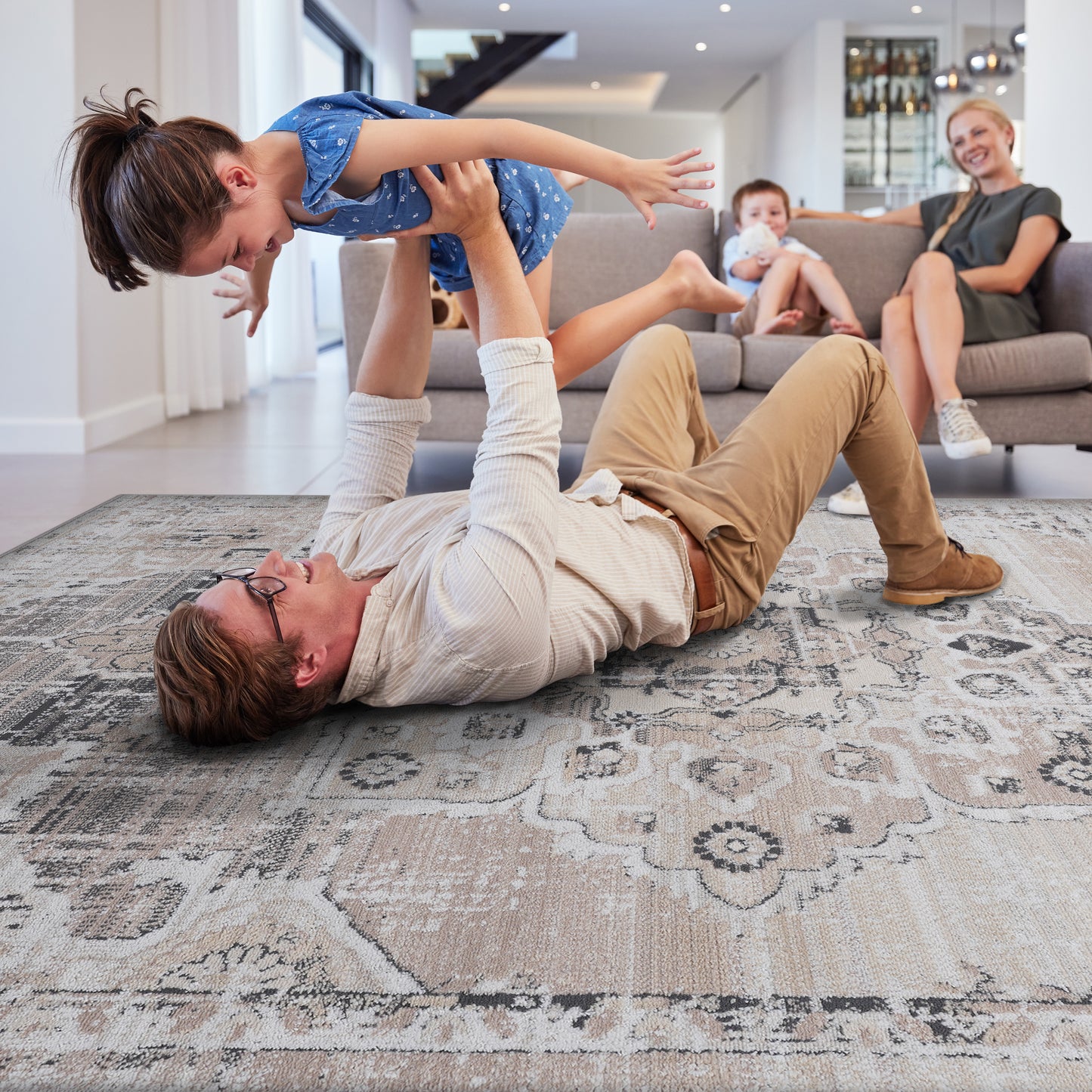 Distressed Persian rug with faded floral pattern in cream and grey tones