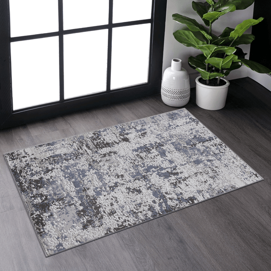 Abstract pattern area rug with grey white and blue tones soft texture