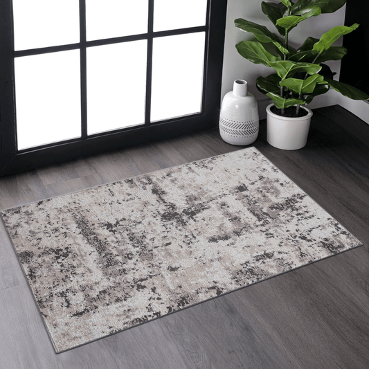 Textured abstract area rug in neutral tones of beige grey and black