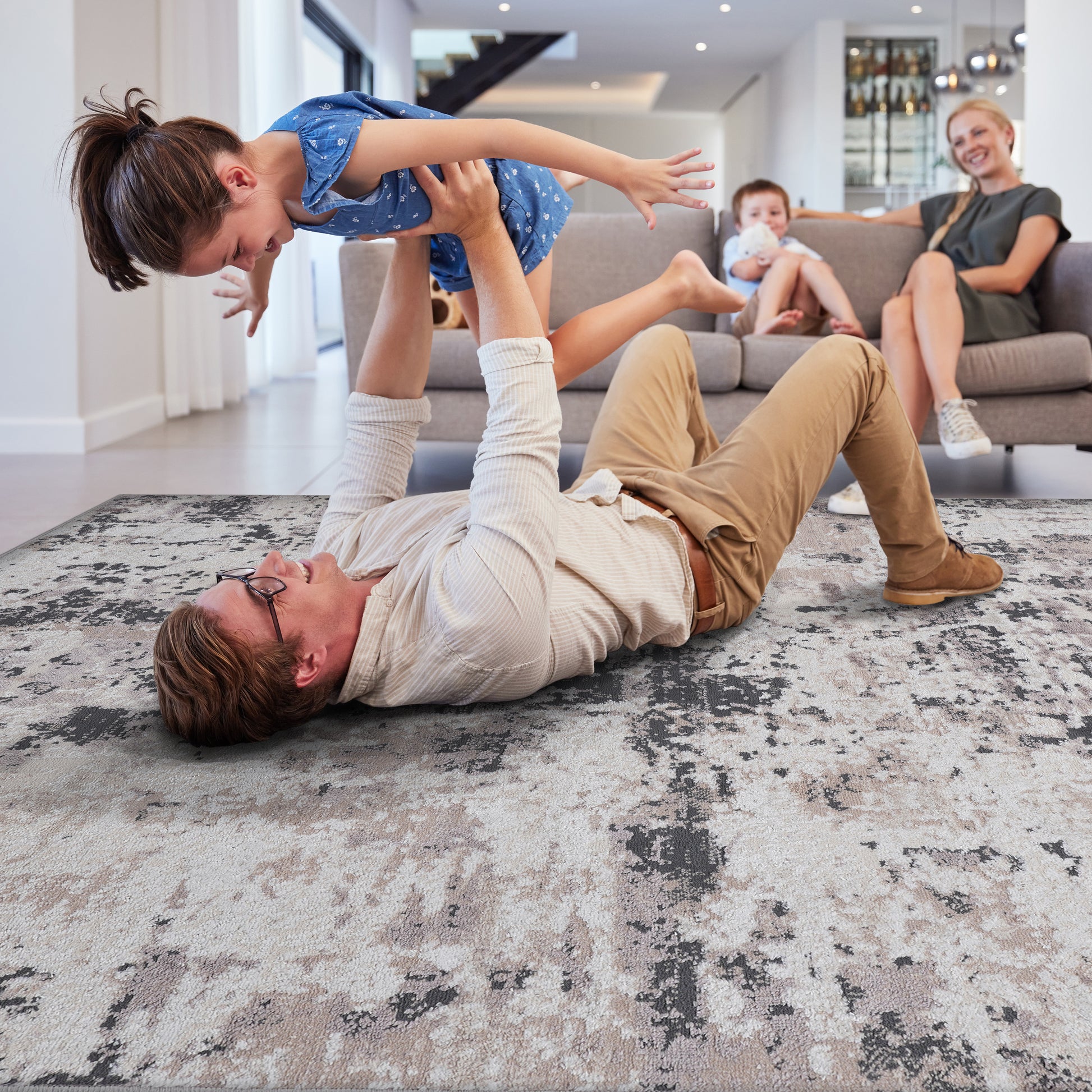 Abstract beige and grey area rug with textured pattern