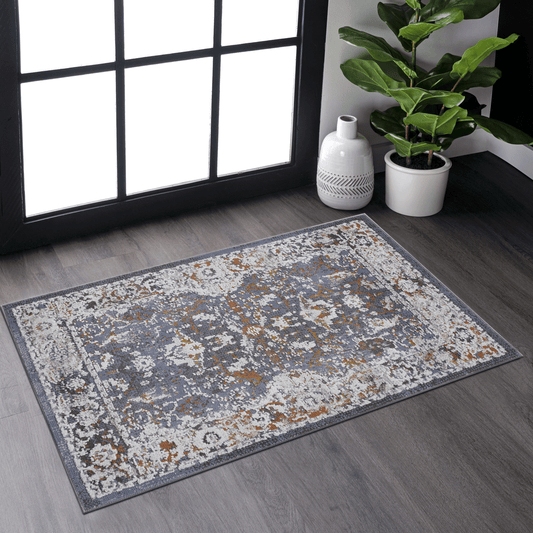 Distressed oriental rug in gray and rust adding vintage charm to any room