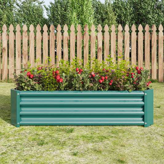 Green corrugated metal raised garden bed with plants and red berries