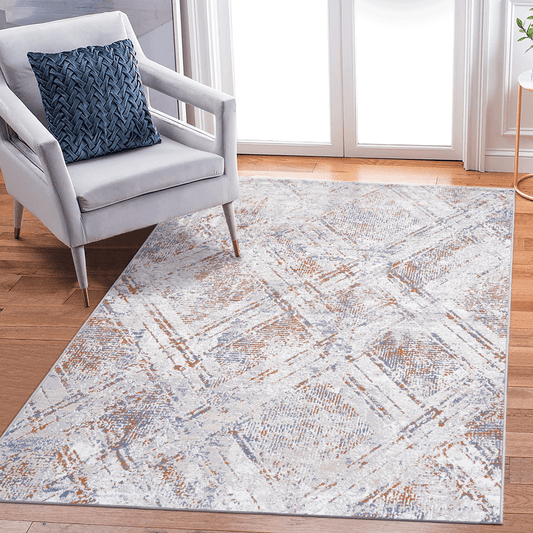 Modern abstract area rug with white grey blue and rust accents