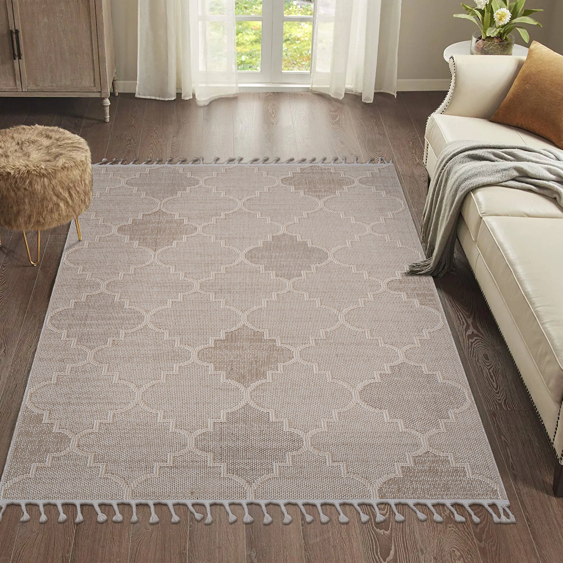 Beige quatrefoil pattern rug with tassels perfect for living rooms