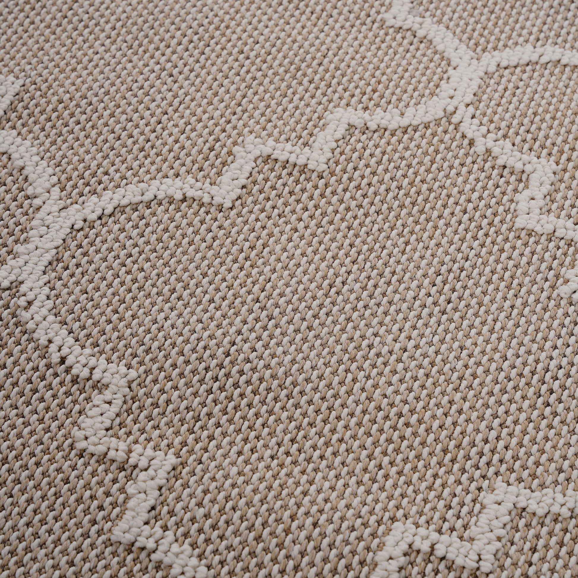 Textured beige and cream rug with a geometric pattern ideal for modern living rooms
