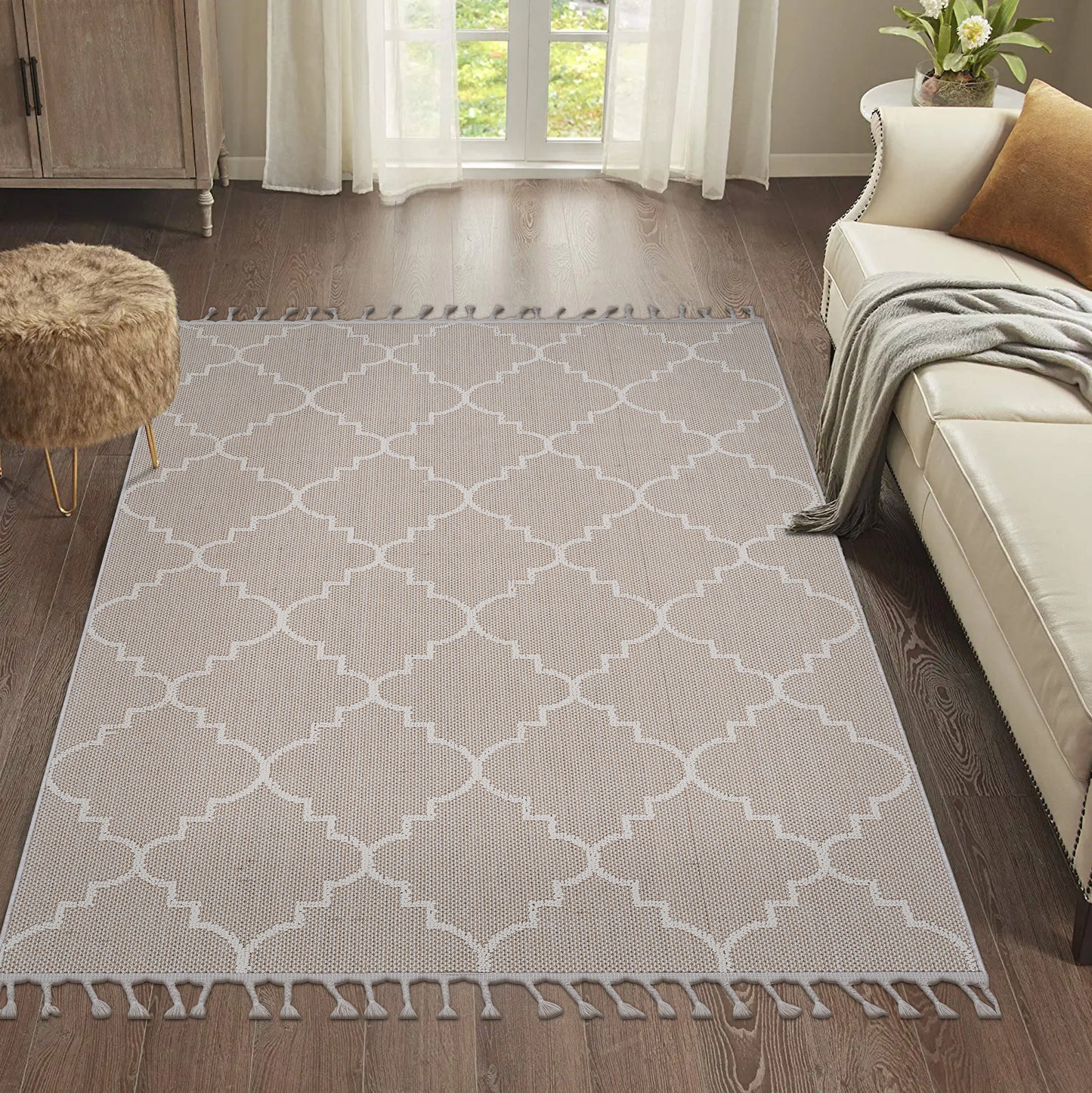 Beige Moroccan trellis rug with white geometric pattern and fringe trim