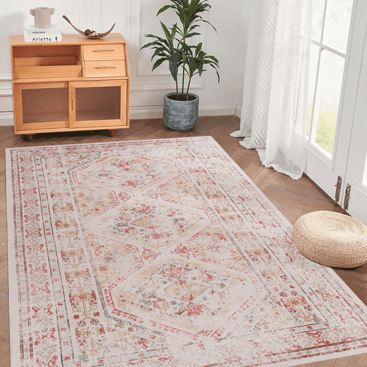 Distressed Persian rug with red gold and grey geometric patterns on a cream background