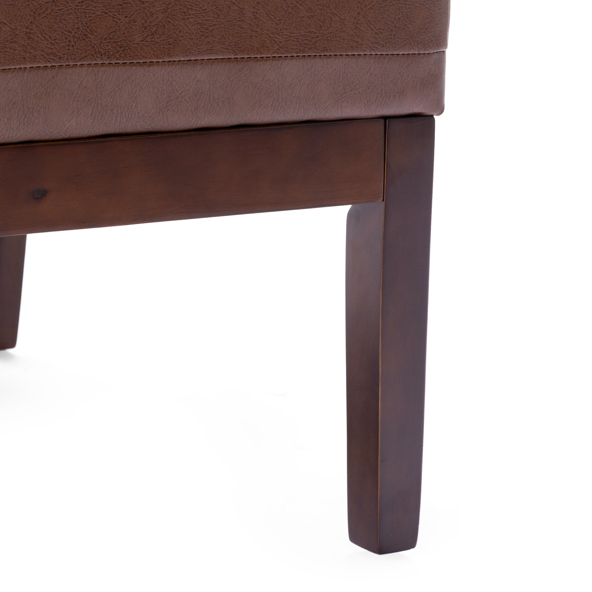 Brown faux leather ottoman with stitched detailing and dark wood legs