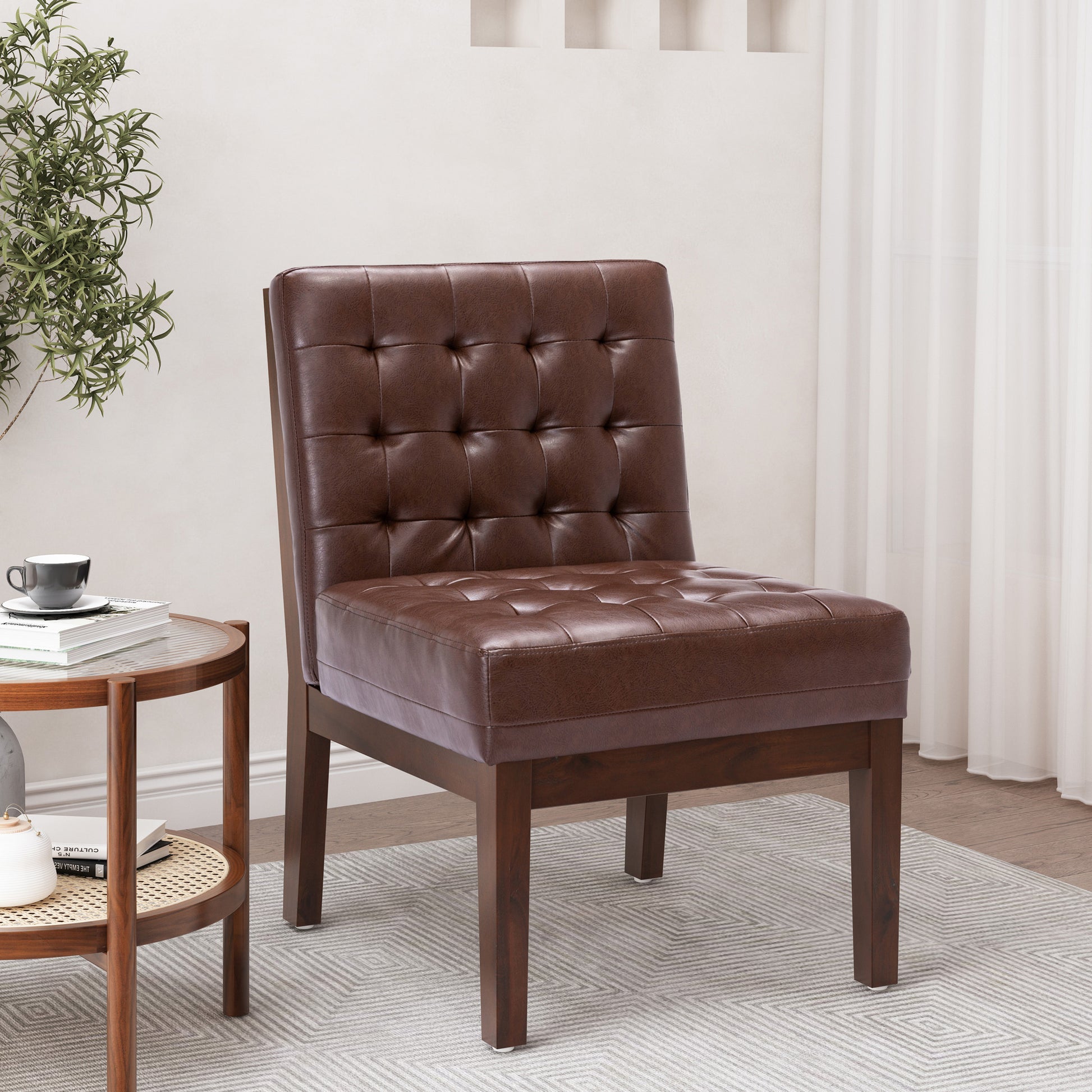 Brown tufted leather accent chair with dark wood legs perfect for a reading nook