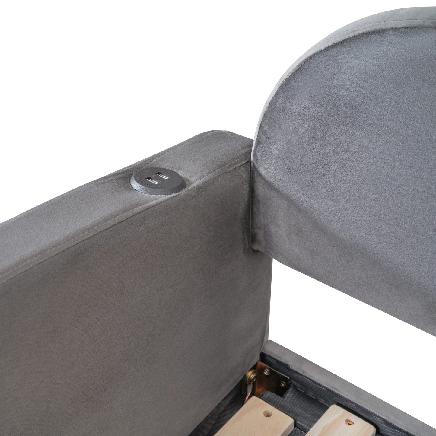 Closeup of a grey velvet headboard detail with integrated USB charging ports for convenience