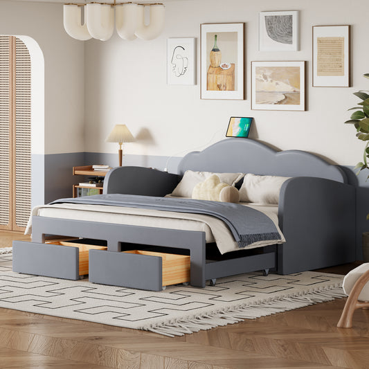 Grey upholstered daybed with cloudshaped headboard and pullout drawers