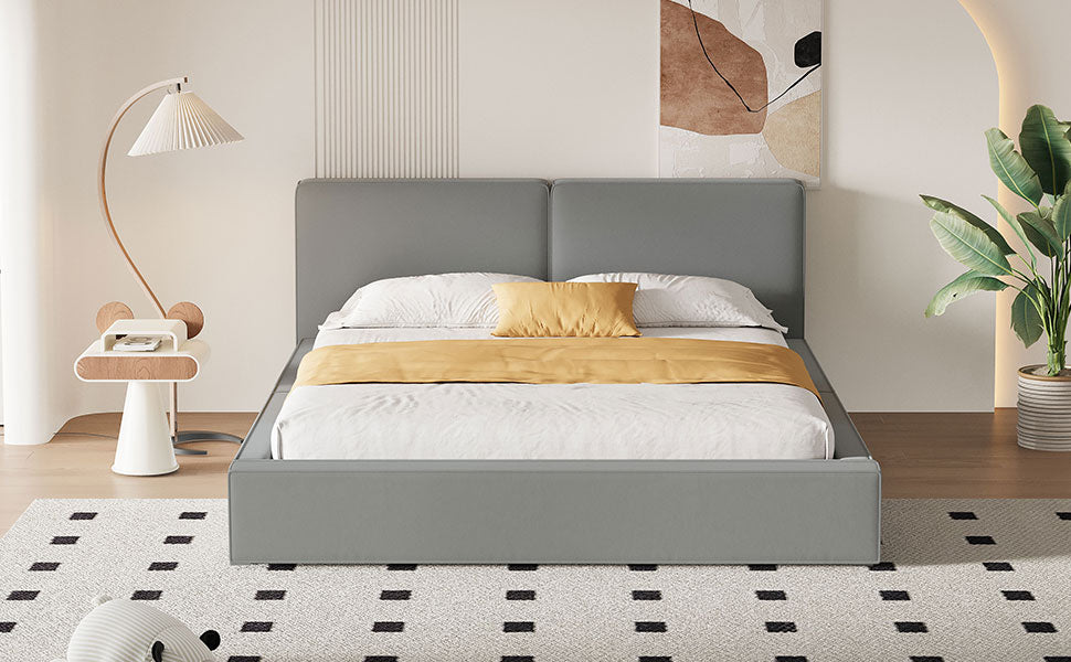 Contemporary grey upholstered queen bed with crisp white linens and a mustard accent pillow
