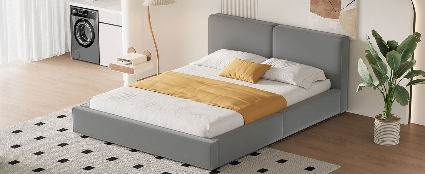 Modern grey upholstered platform bed with yellow accent throw and pillows