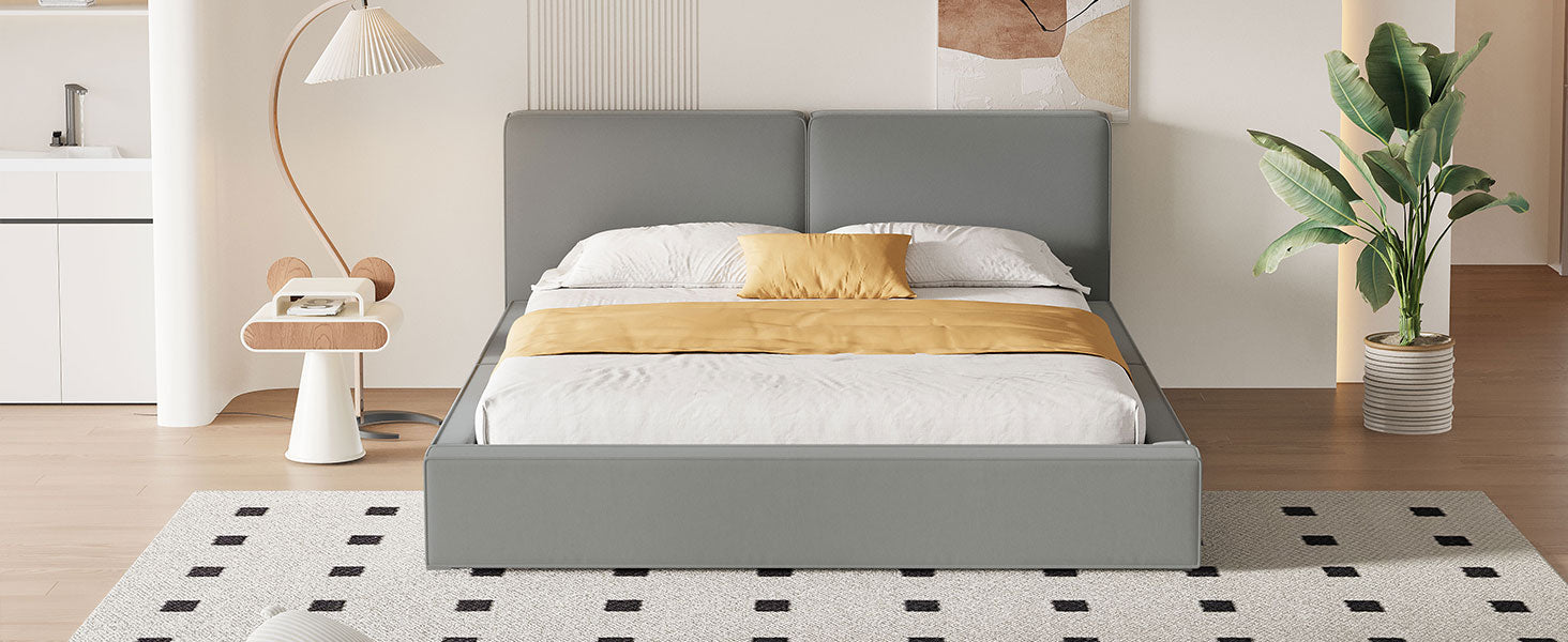 Gray upholstered platform bed with white bedding and yellow accent pillow