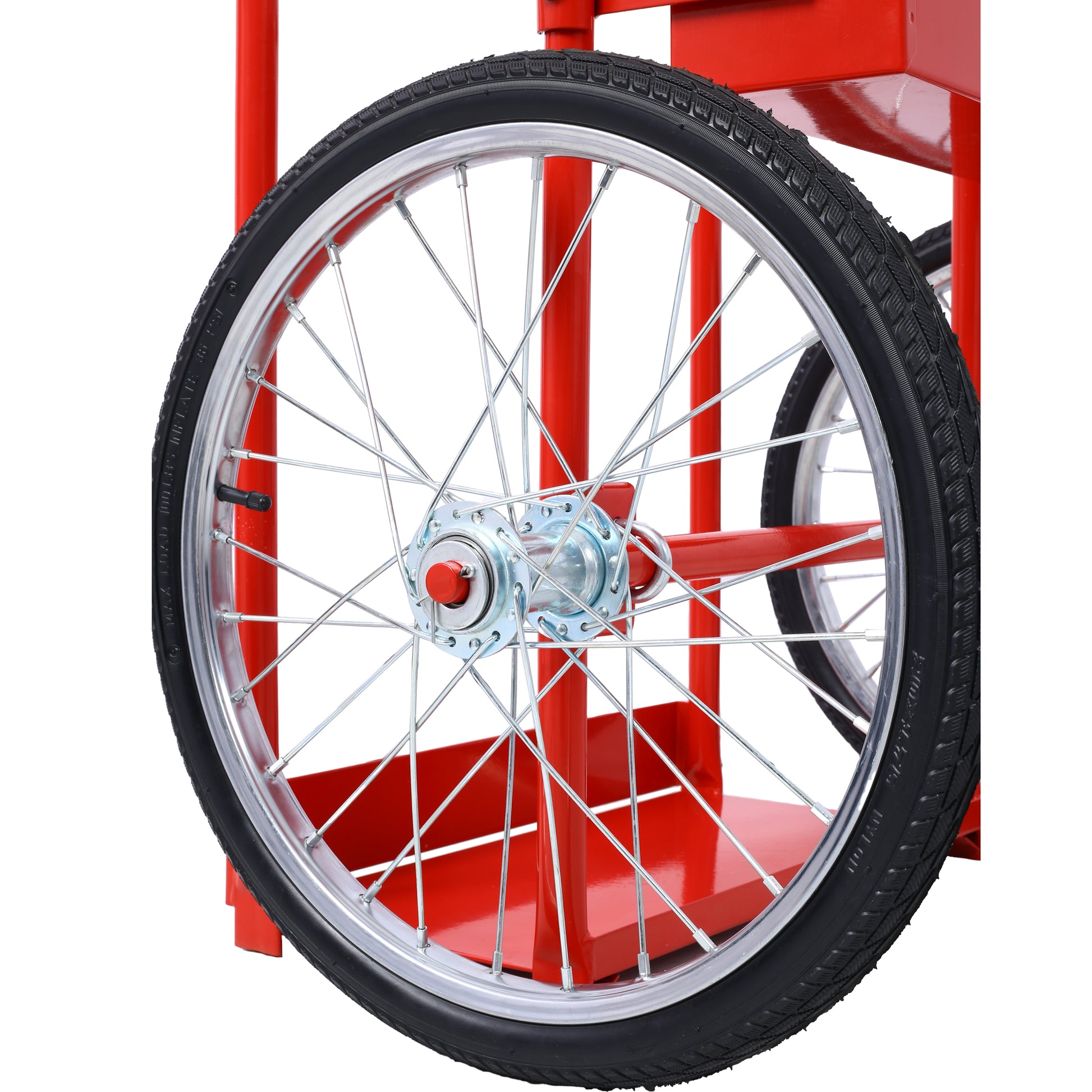Close up of a spoked wheel on a red popcorn cart