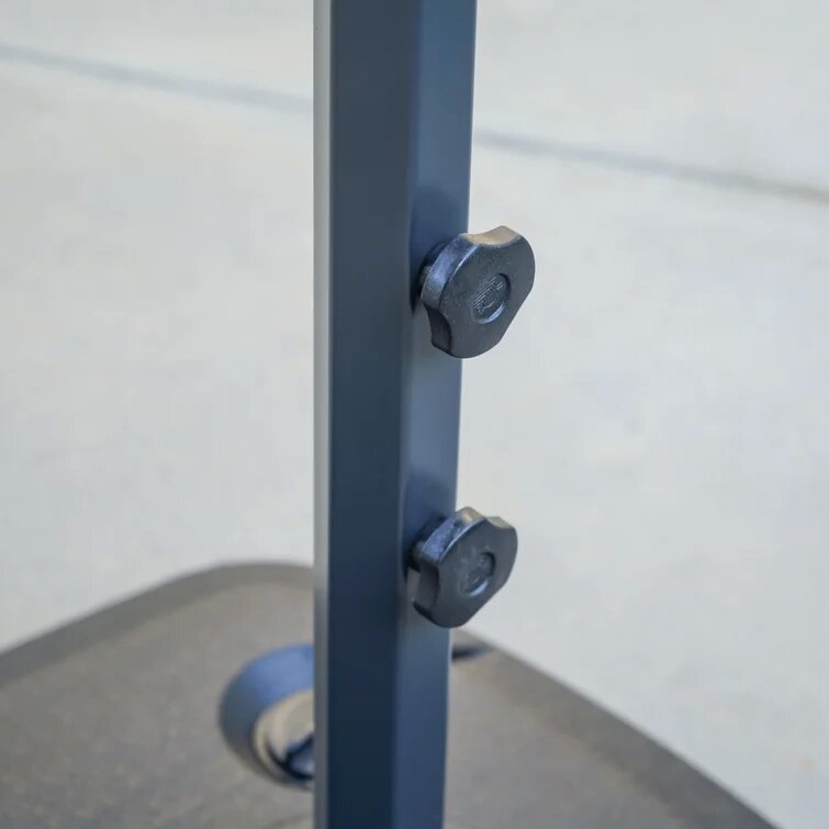 Dark gray umbrella pole with two black adjustment knobs