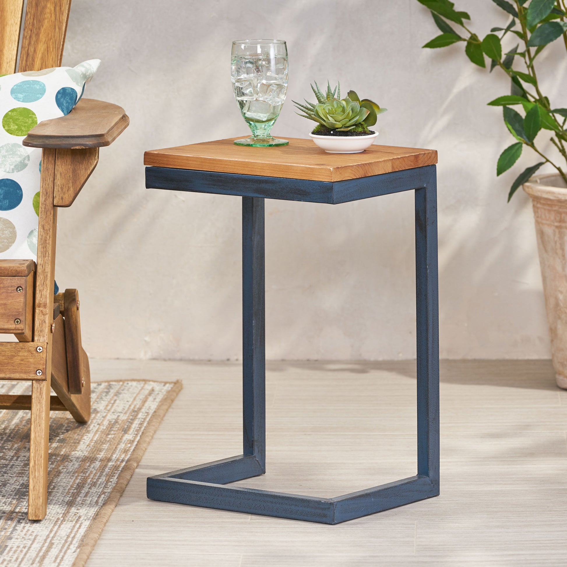 Wooden top ctable with distressed navy metal frame and modern design
