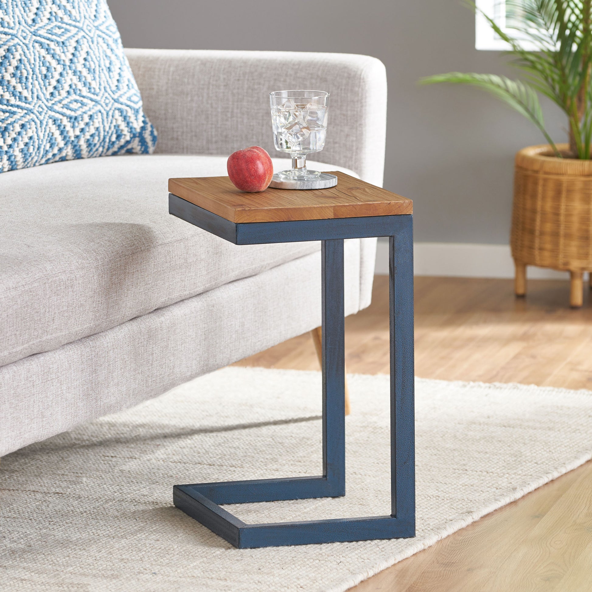 Modern ctable with rustic wood top and distressed navy metal frame perfect for living room use