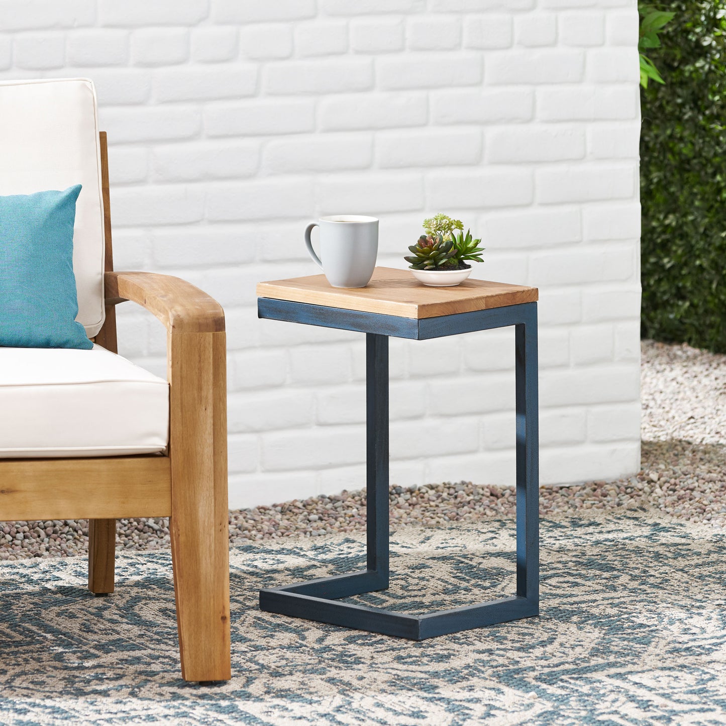 Natural wood and metal outdoor ctable with blue frame perfect for patio use