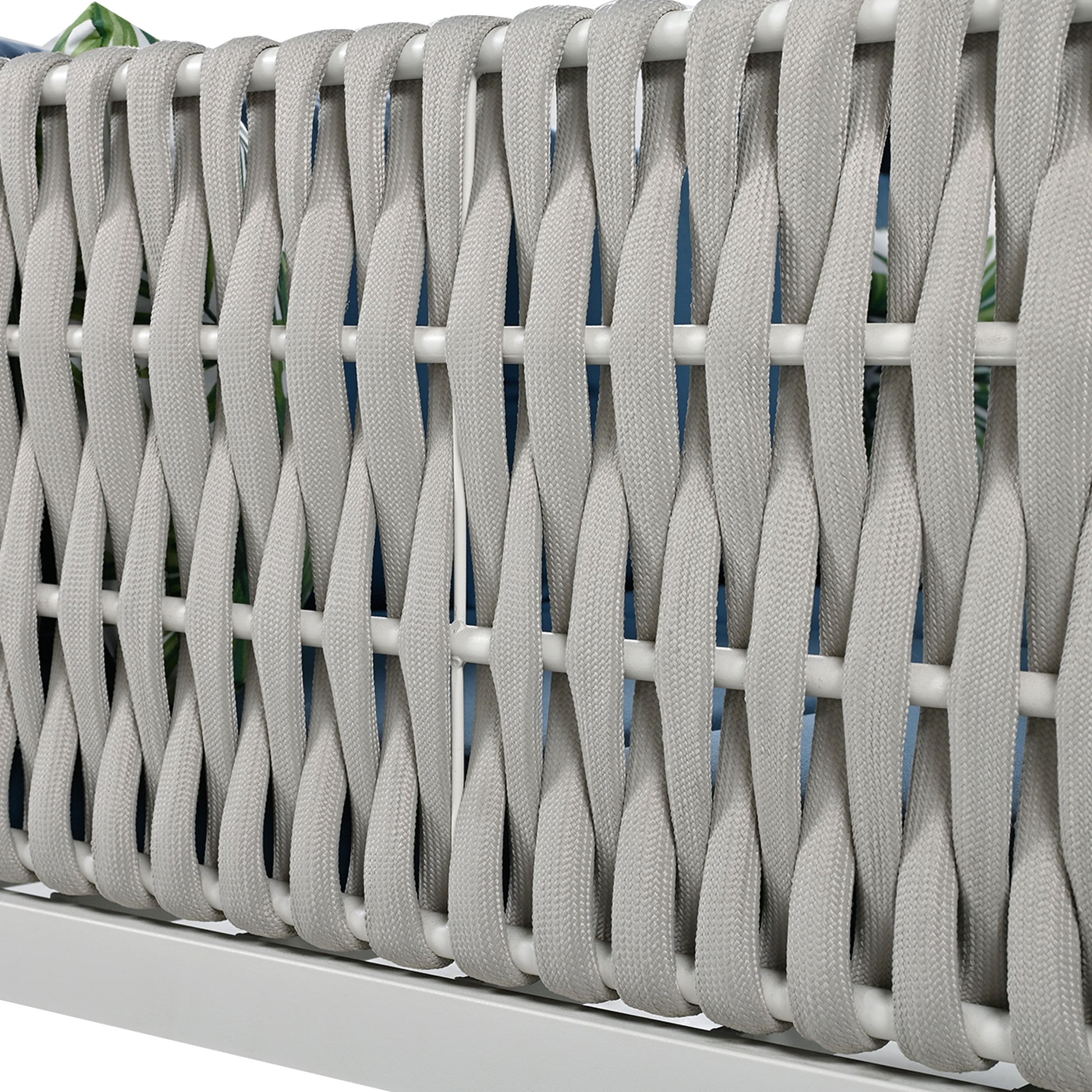 Closeup of grey woven rope detail on a modern outdoor chair