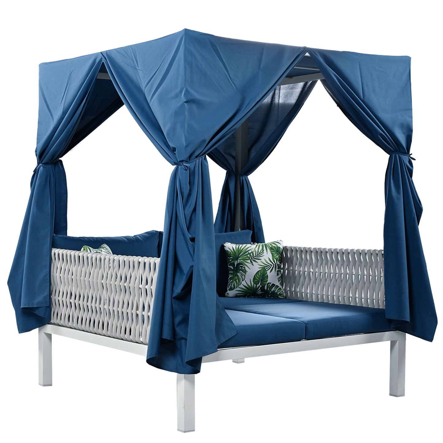 Blue cabana daybed with white wicker accents and tropical print cushions