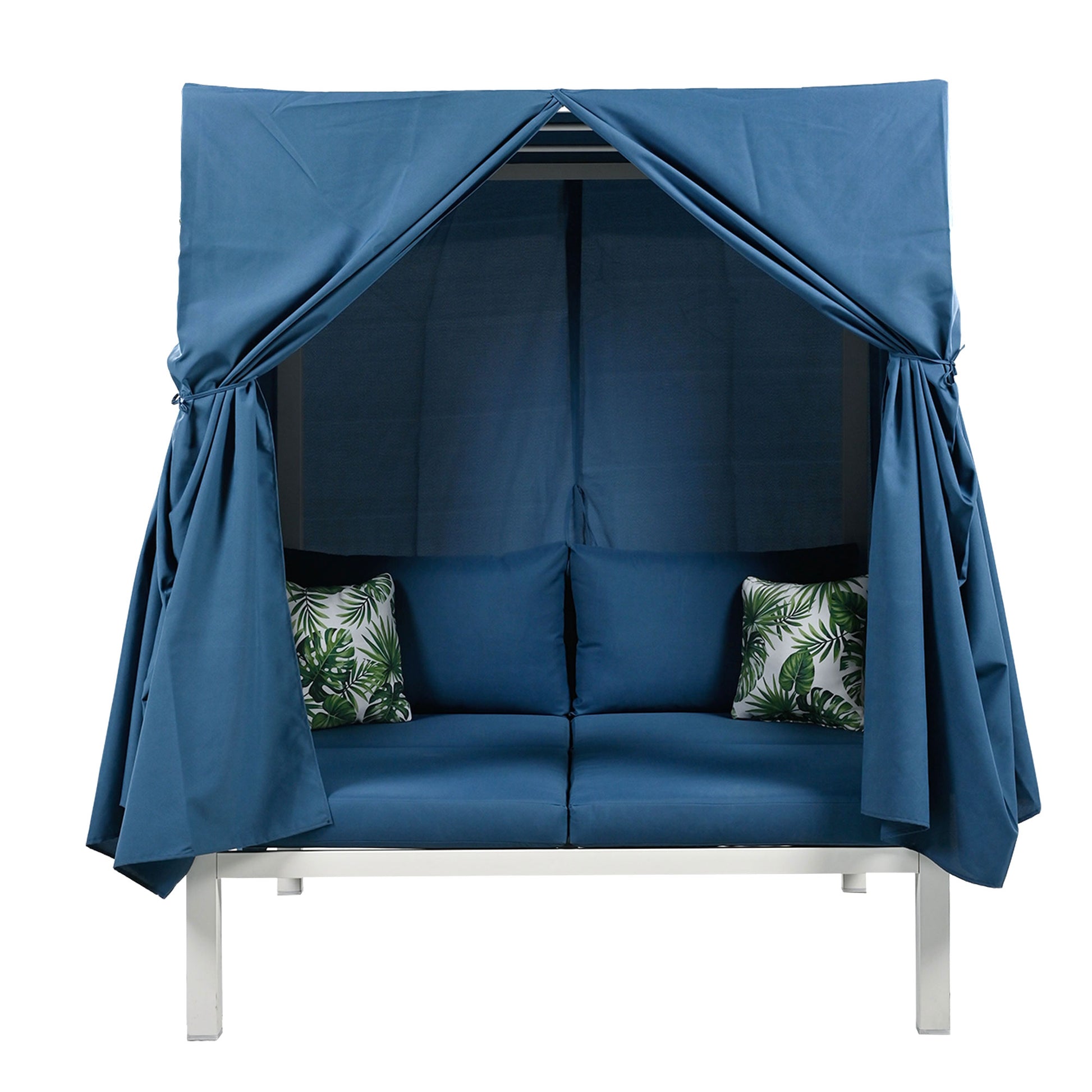 Blue outdoor daybed with draped canopy and leaf print pillows for patio relaxation