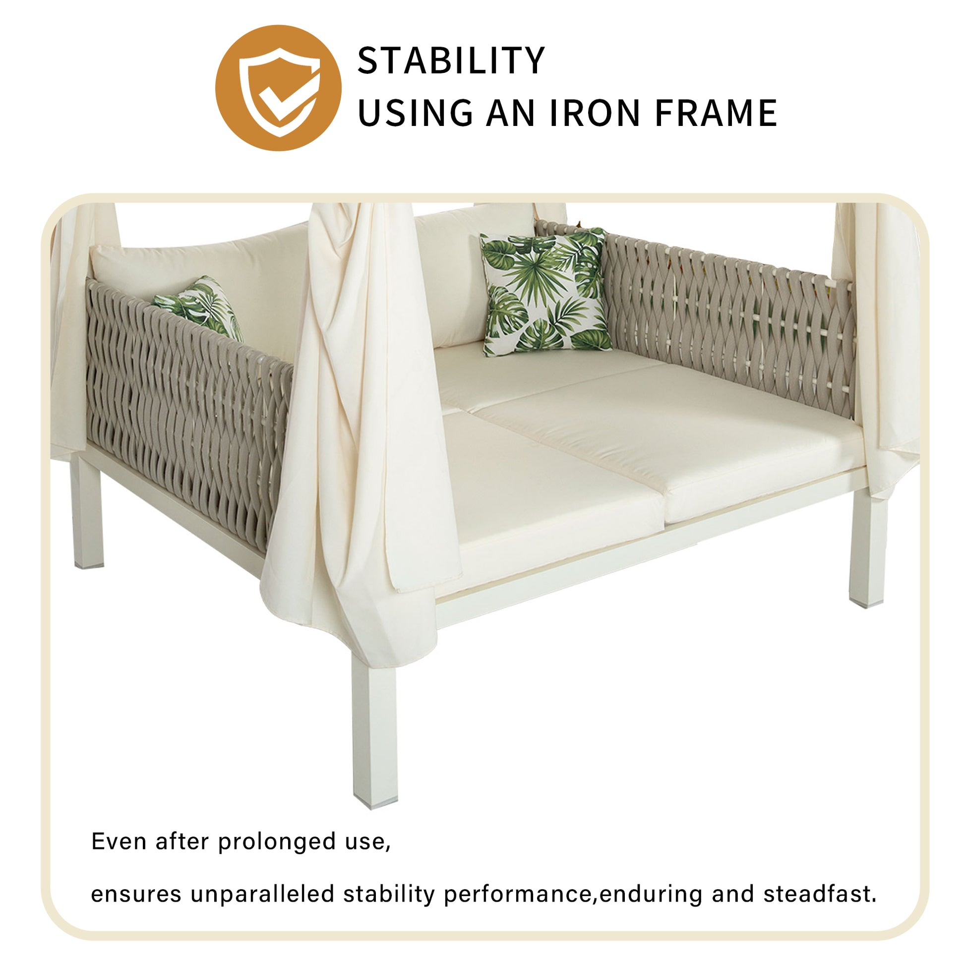 White outdoor canopy daybed with neutral cushions and tropical pillows featuring a woven gray frame