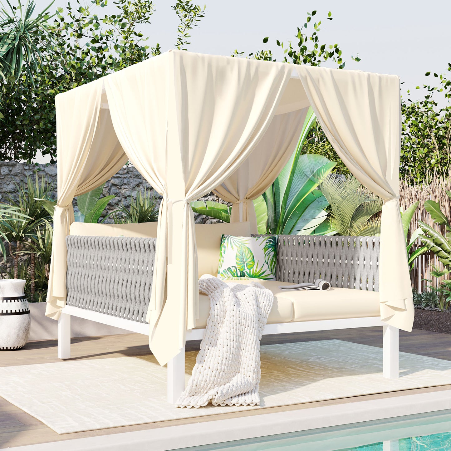 Cream cabana daybed with gray woven sides and palm print pillow