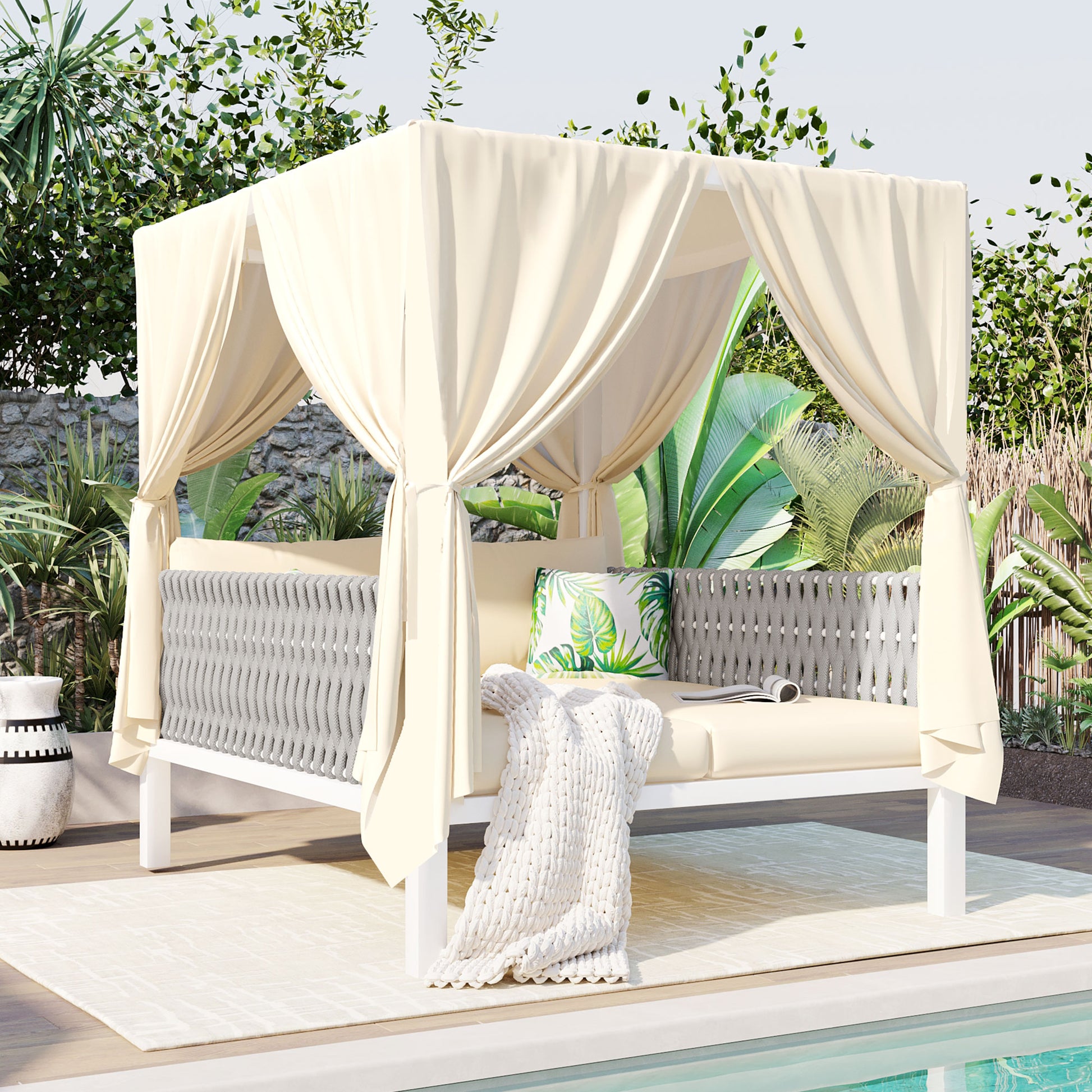 Cream cabana daybed with gray woven sides and palm print pillow