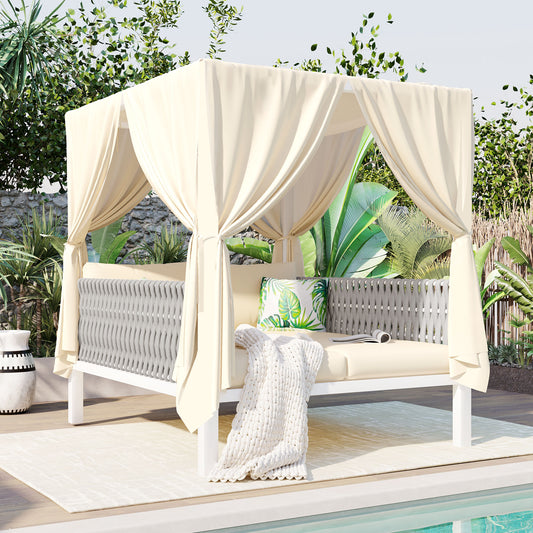 Cream cabana daybed with gray woven sides and palm print pillow