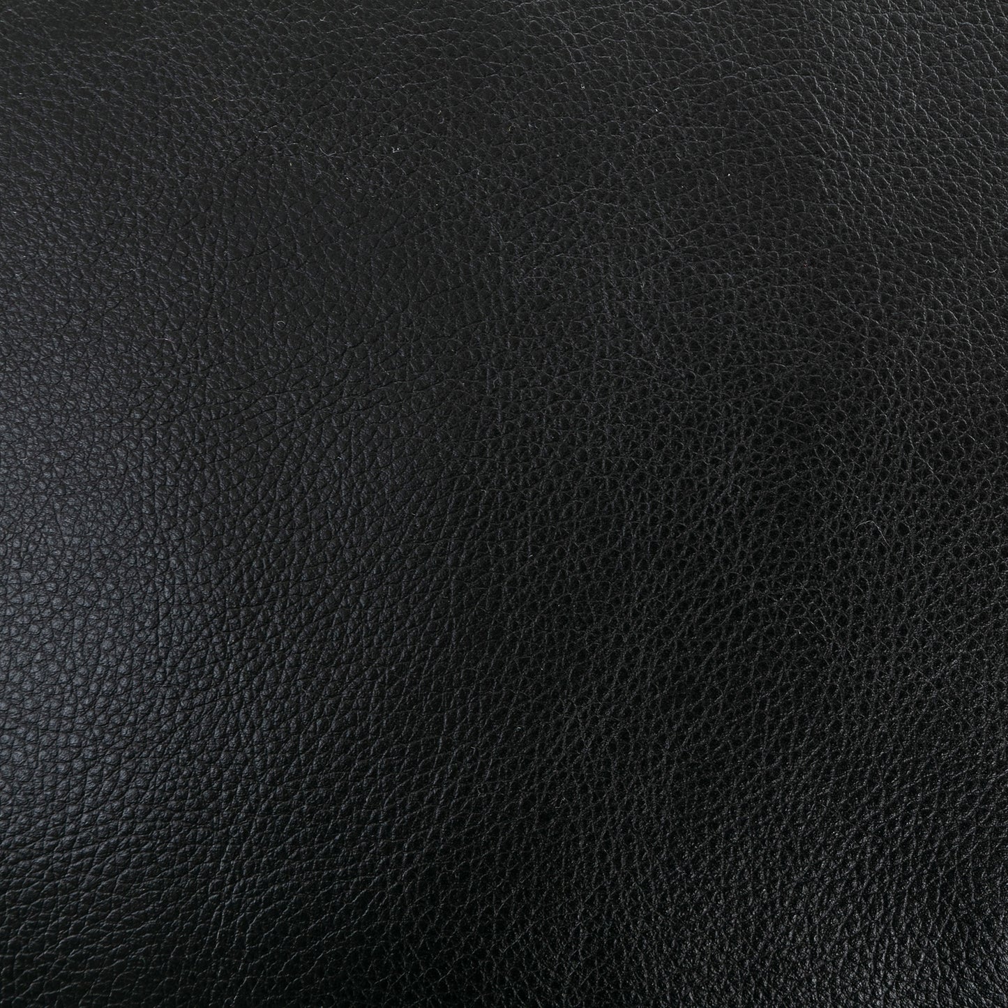 Textured black leather material closeup ideal for upholstery