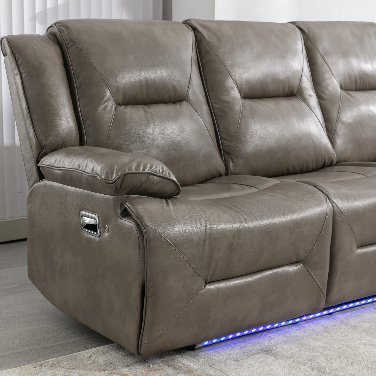 Taupe leather recliner sofa with chrome release lever and blue LED accent lighting