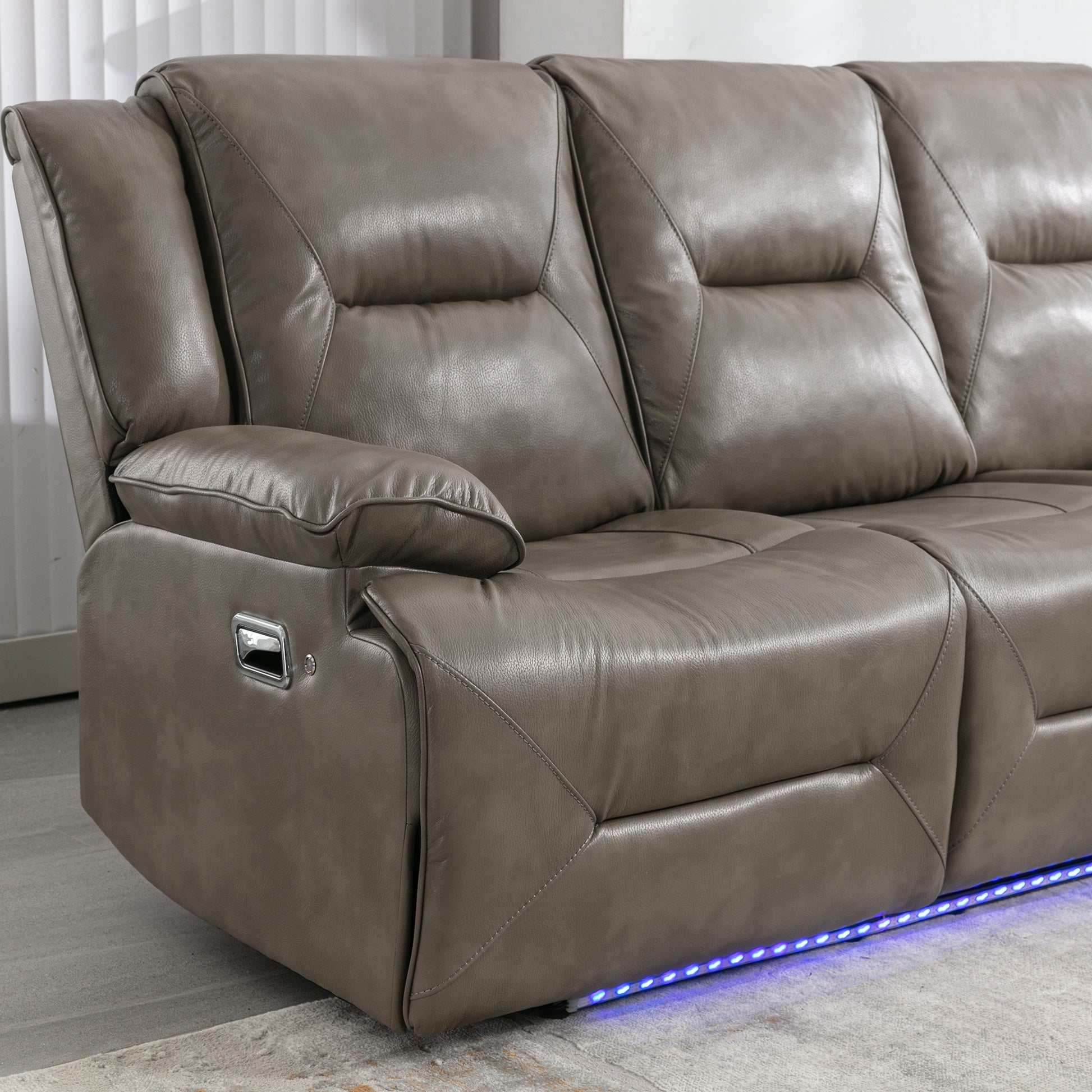 Taupe leather recliner sofa with chrome release lever and blue LED accent lighting