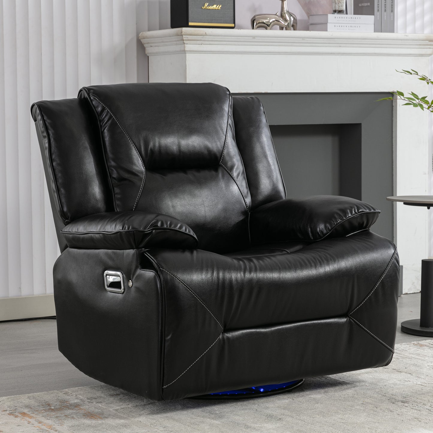 Plush black leather recliner chair with silver side lever for easy adjustment