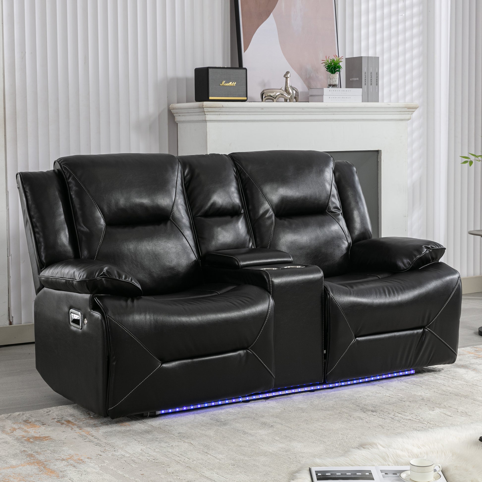 Black leather dual reclining sofa with cup holders and LED base lighting