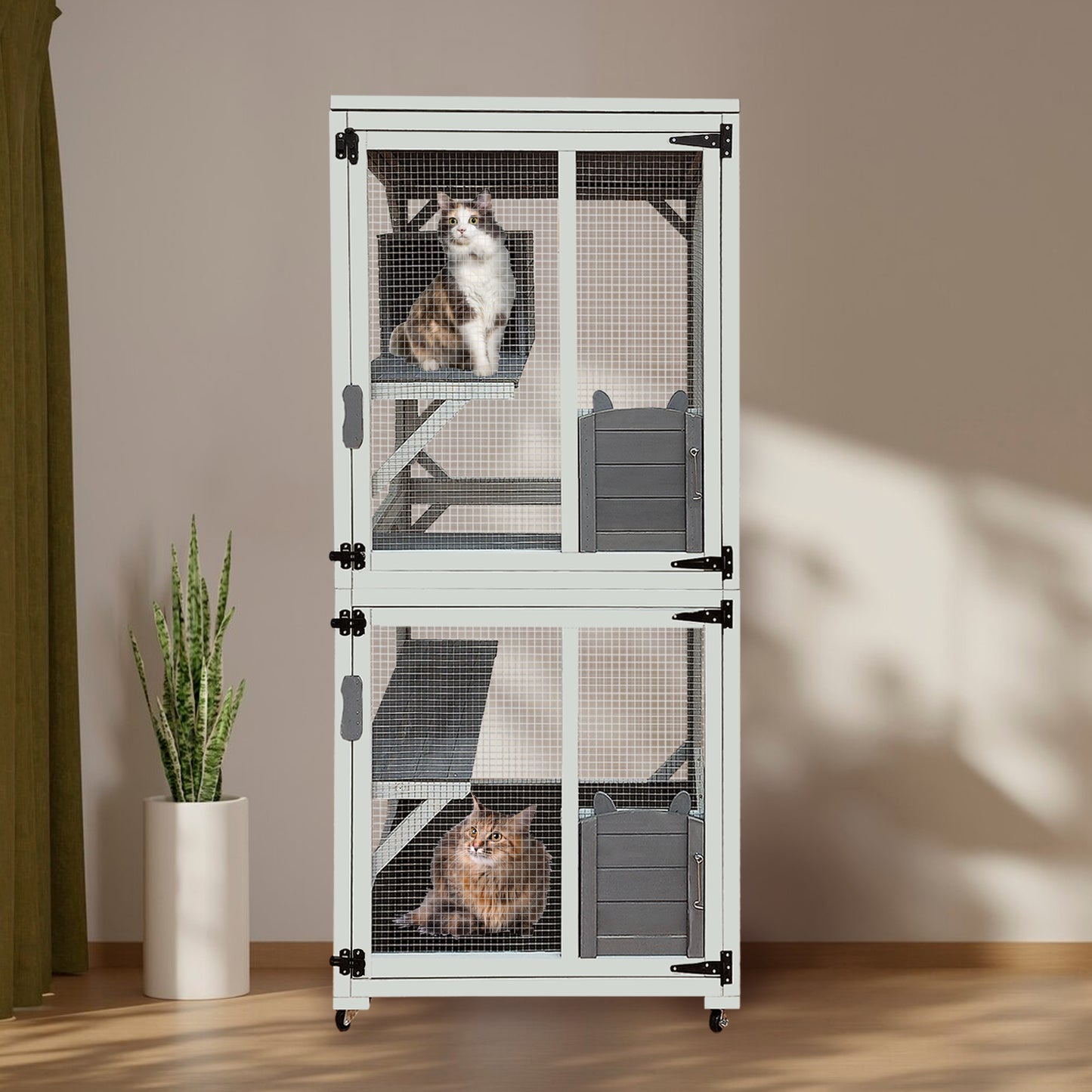 White multilevel cat condo with two cats featuring ramps and enclosed sleeping areas