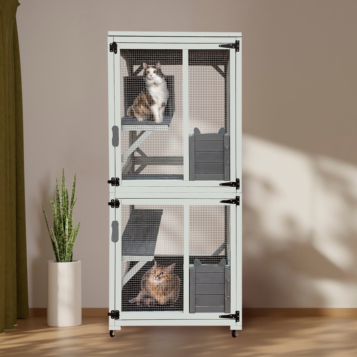 White multilevel cat condo with two cats featuring ramps and enclosed sleeping areas