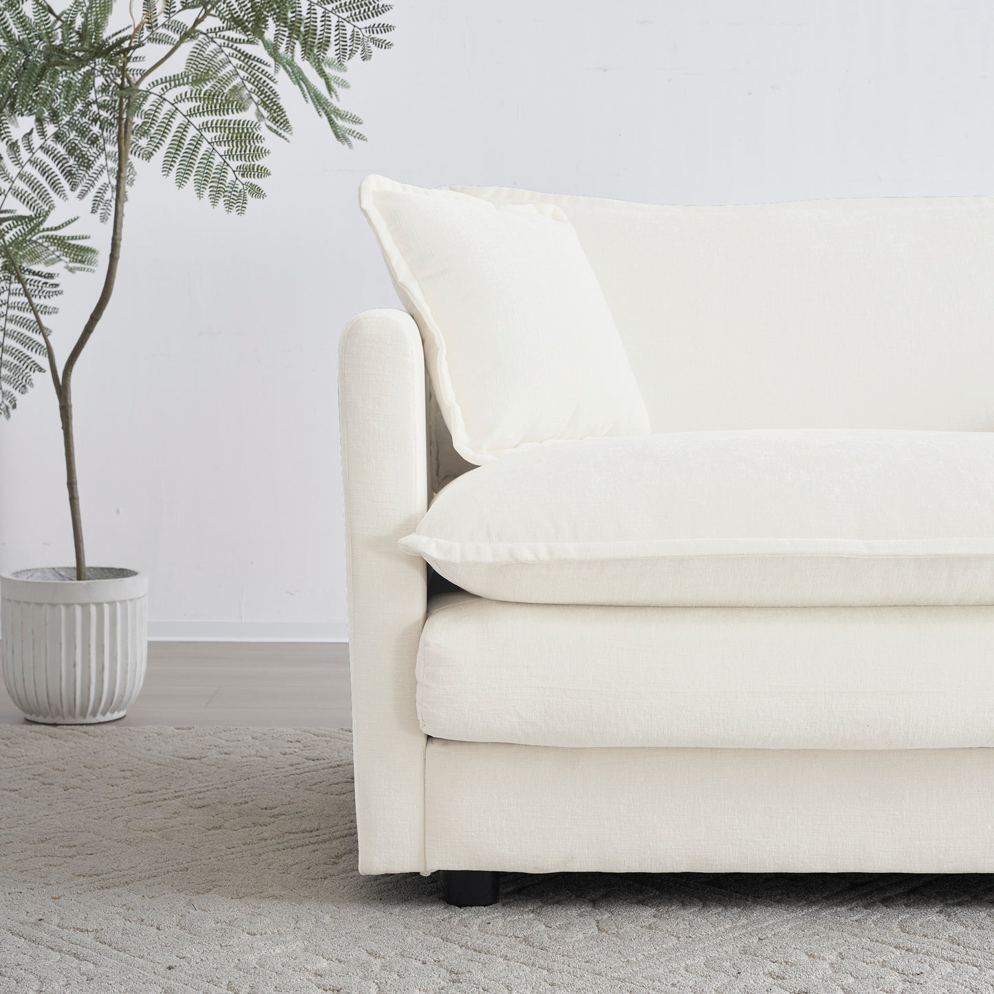 Plush ivory fabric sofa with deep cushions and modern clean lines