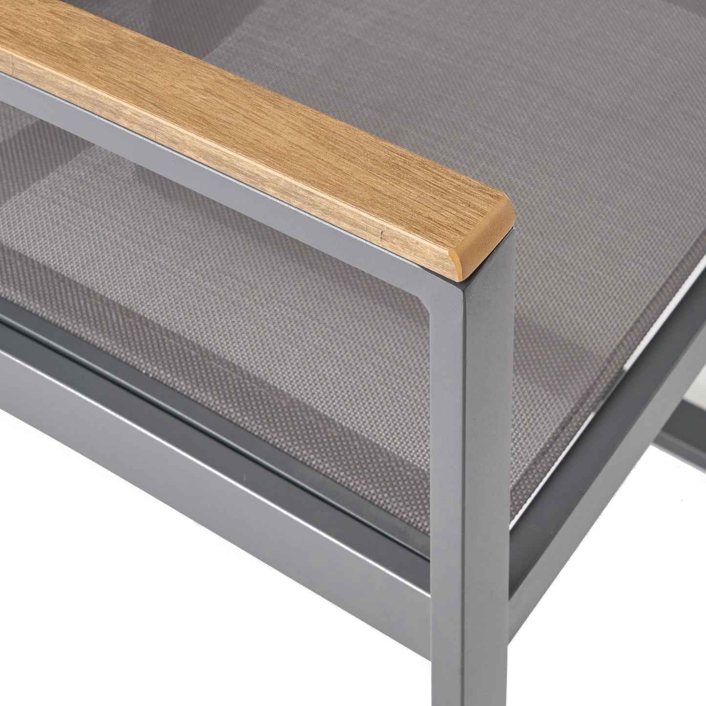 Close up of a grey metal outdoor chair with a natural wood armrest