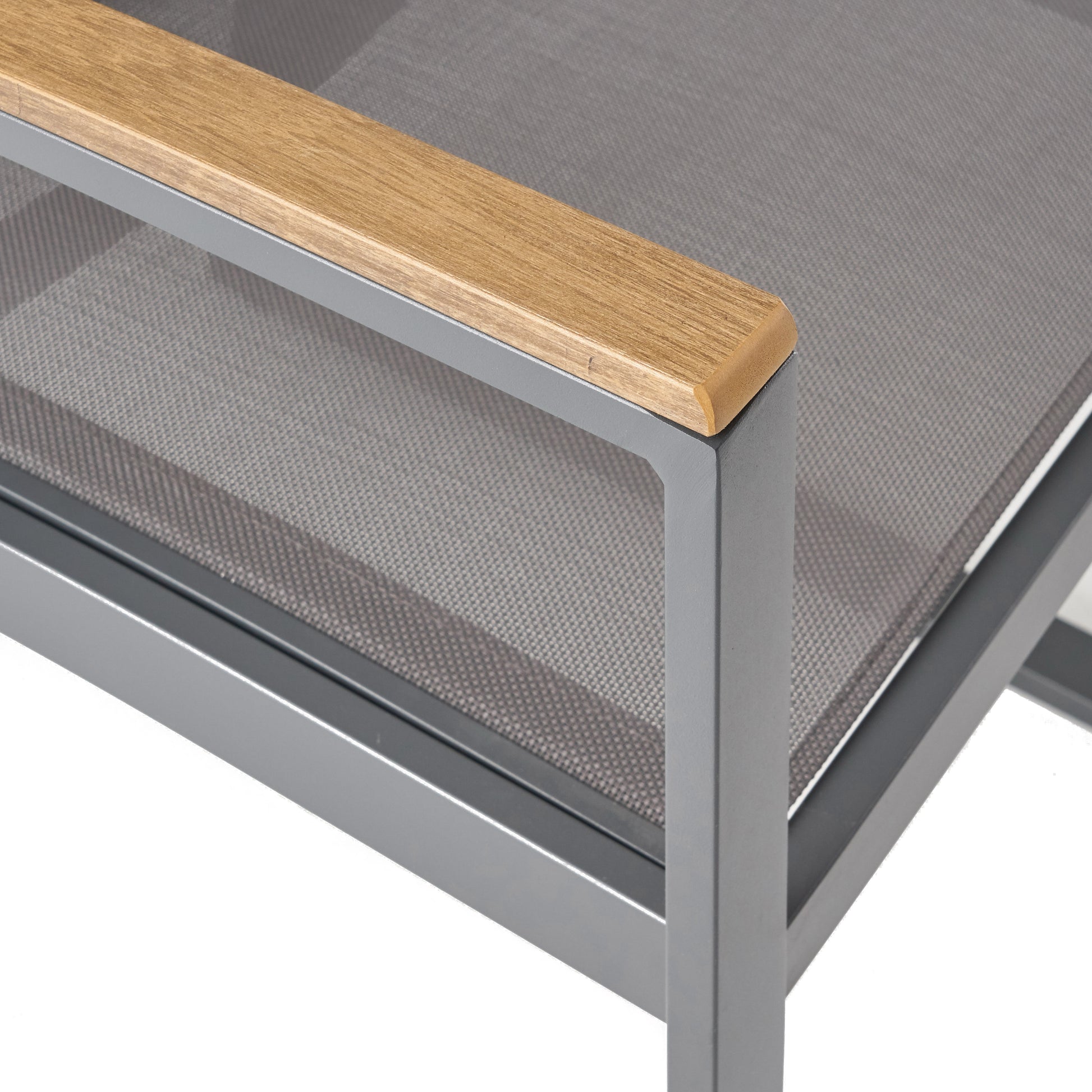 Close up of a grey metal outdoor chair with a natural wood armrest
