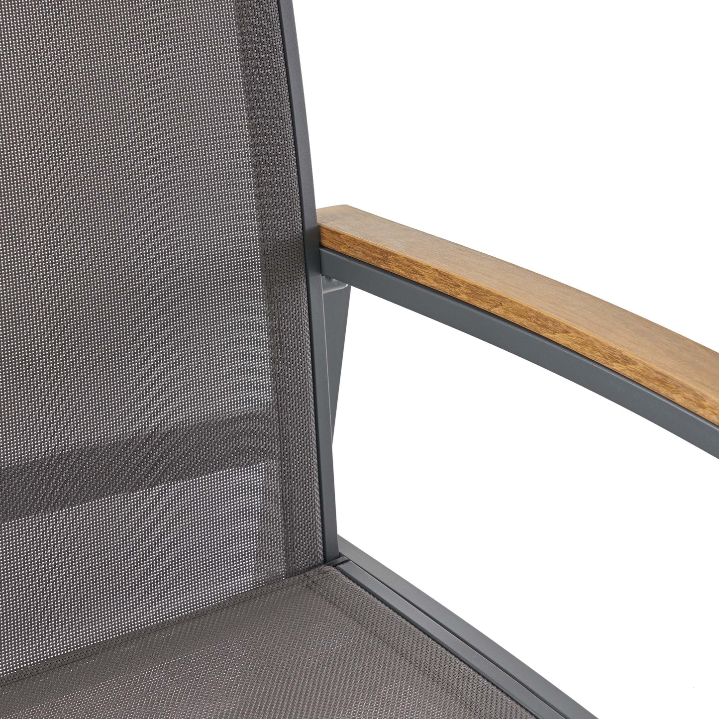 Closeup of a grey mesh armchair seat with wooden armrest