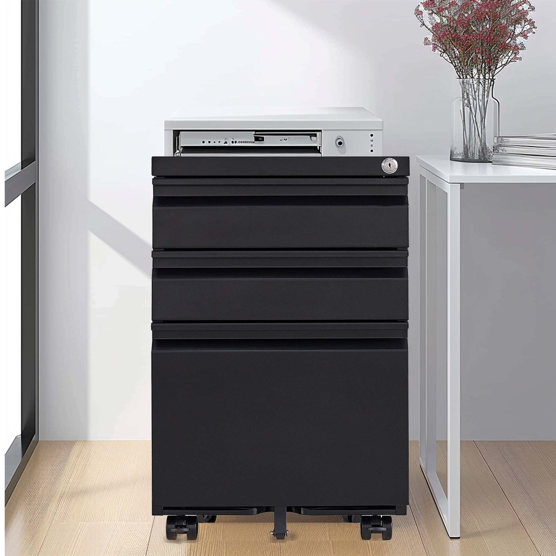 Sleek black metal filing cabinet with three drawers and lockable top compartment for secure storage