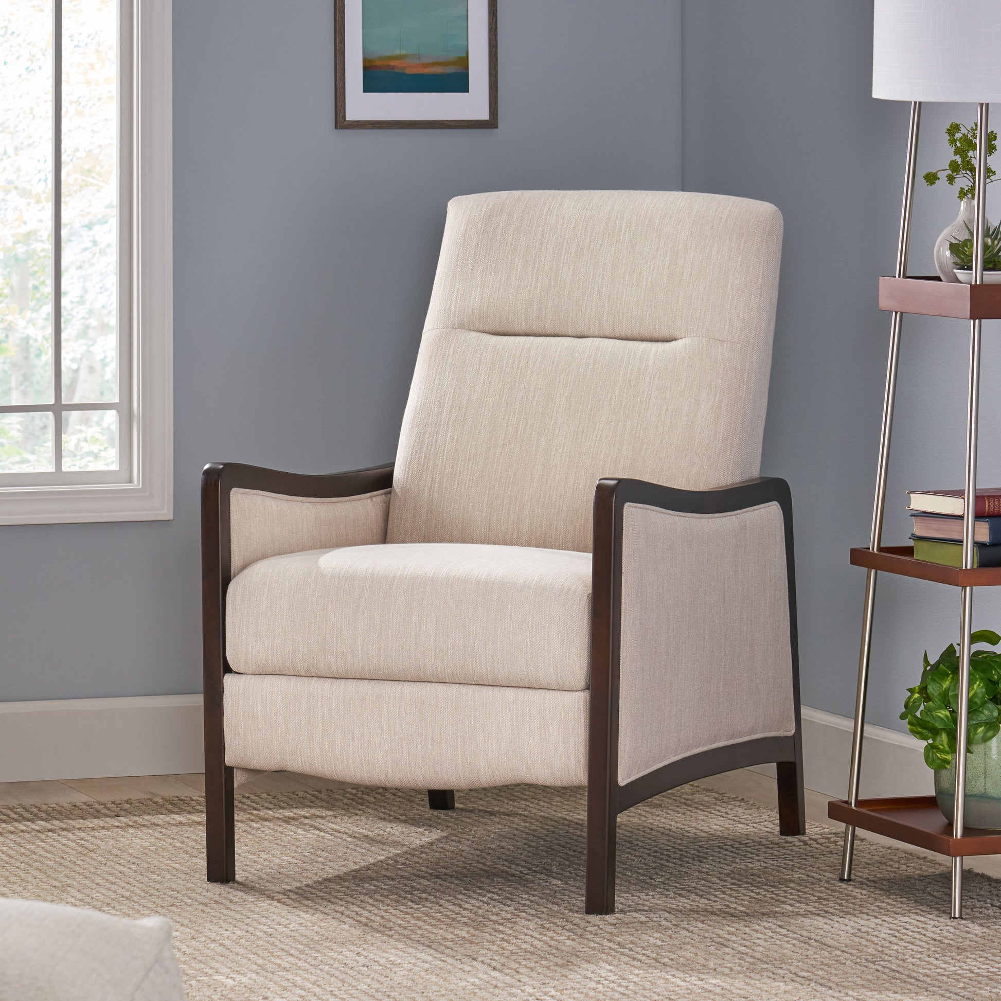 Cream upholstered accent chair with dark wood arms and legs in a living room