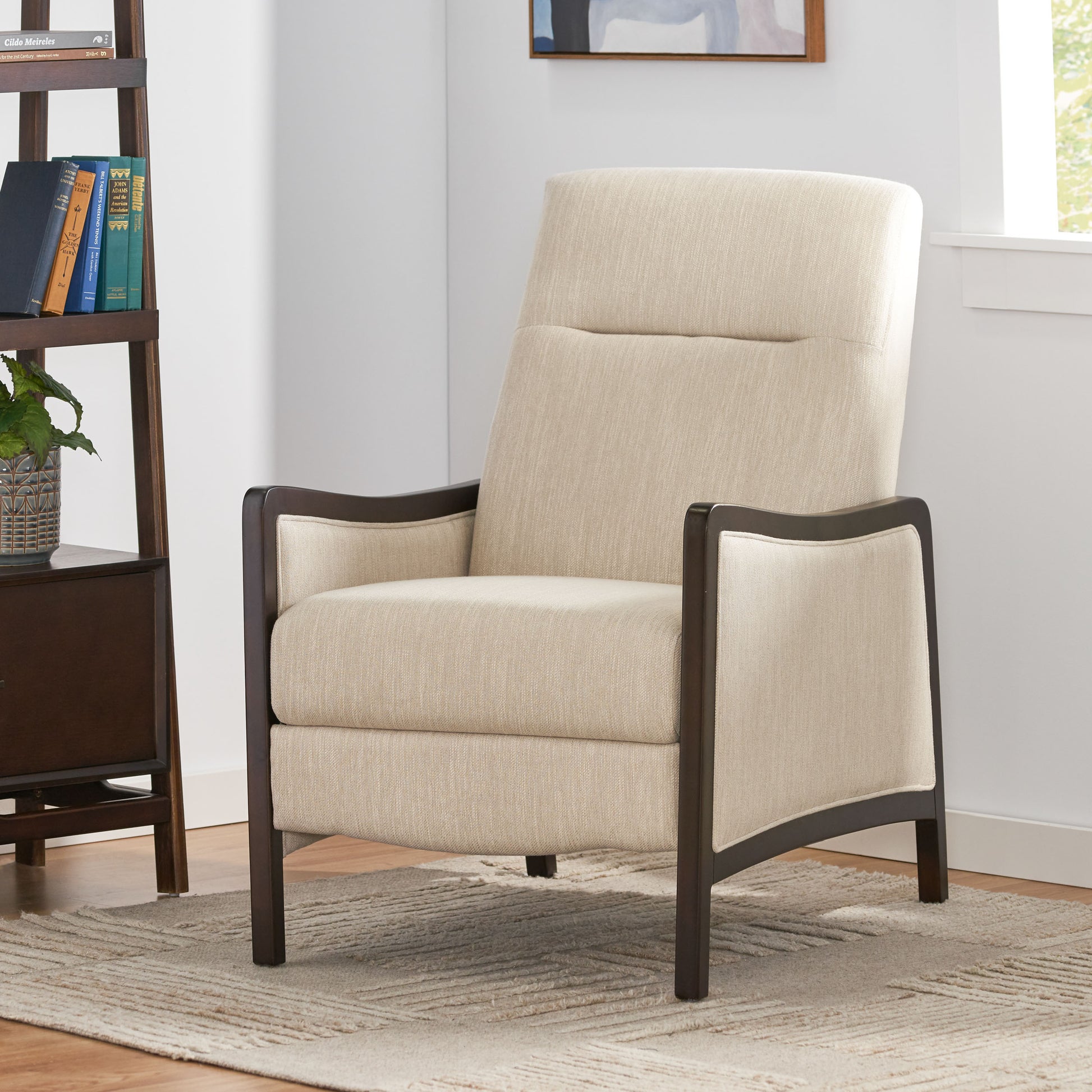 Cream fabric armchair with dark wood frame perfect for a reading nook
