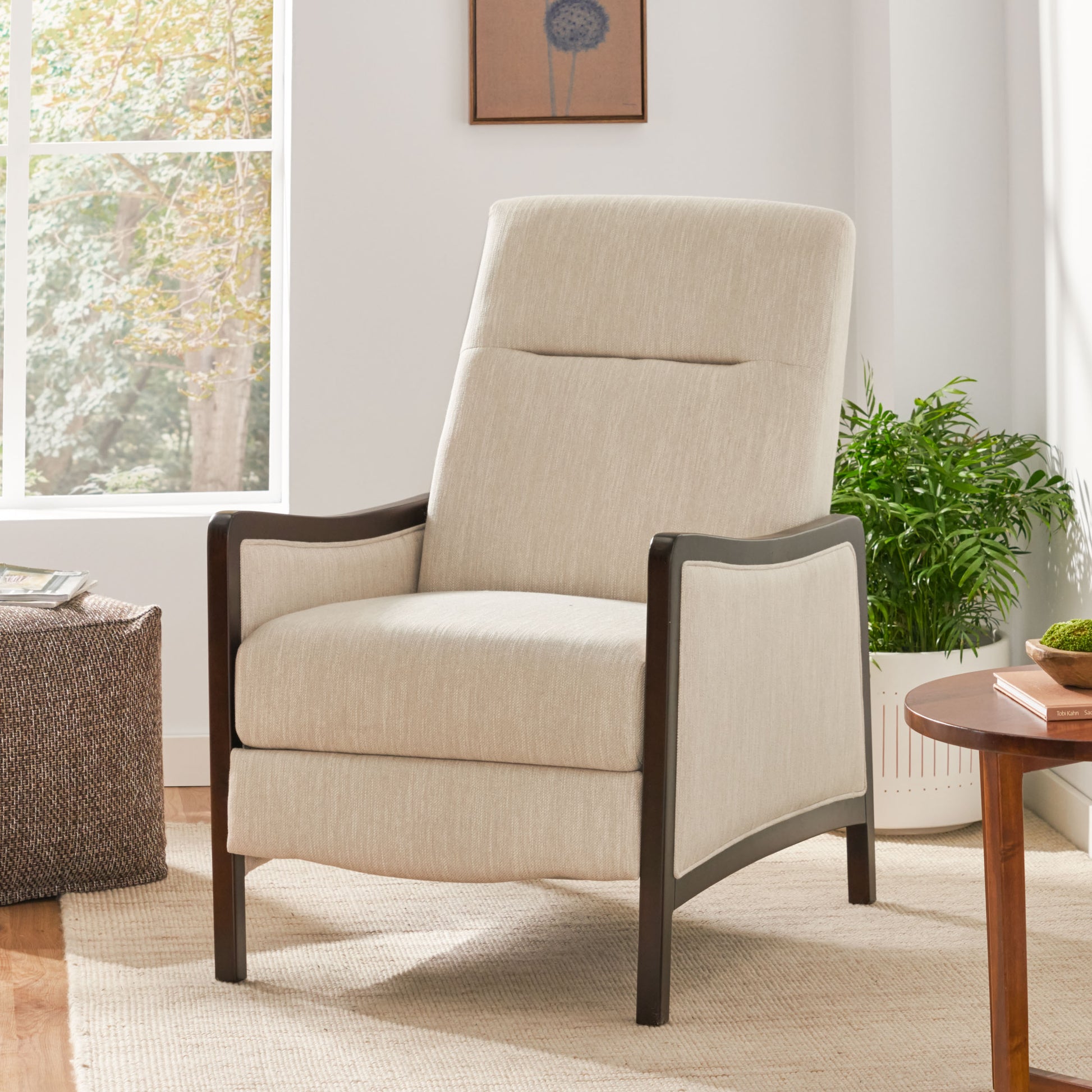 Tall linen armchair in cream with dark wood accents perfect for a modern living room