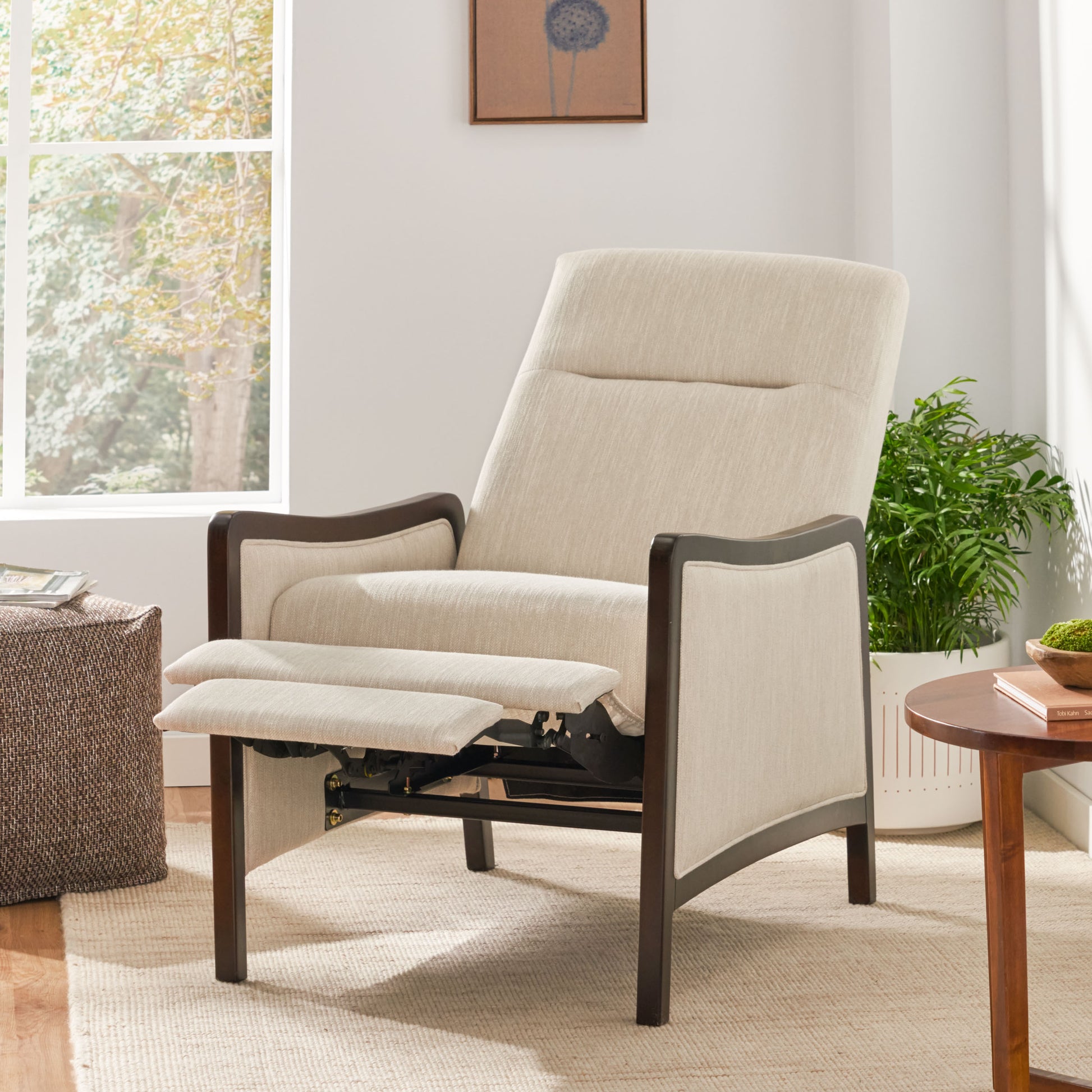 Light beige fabric recliner chair with dark wood trim and extended footrest